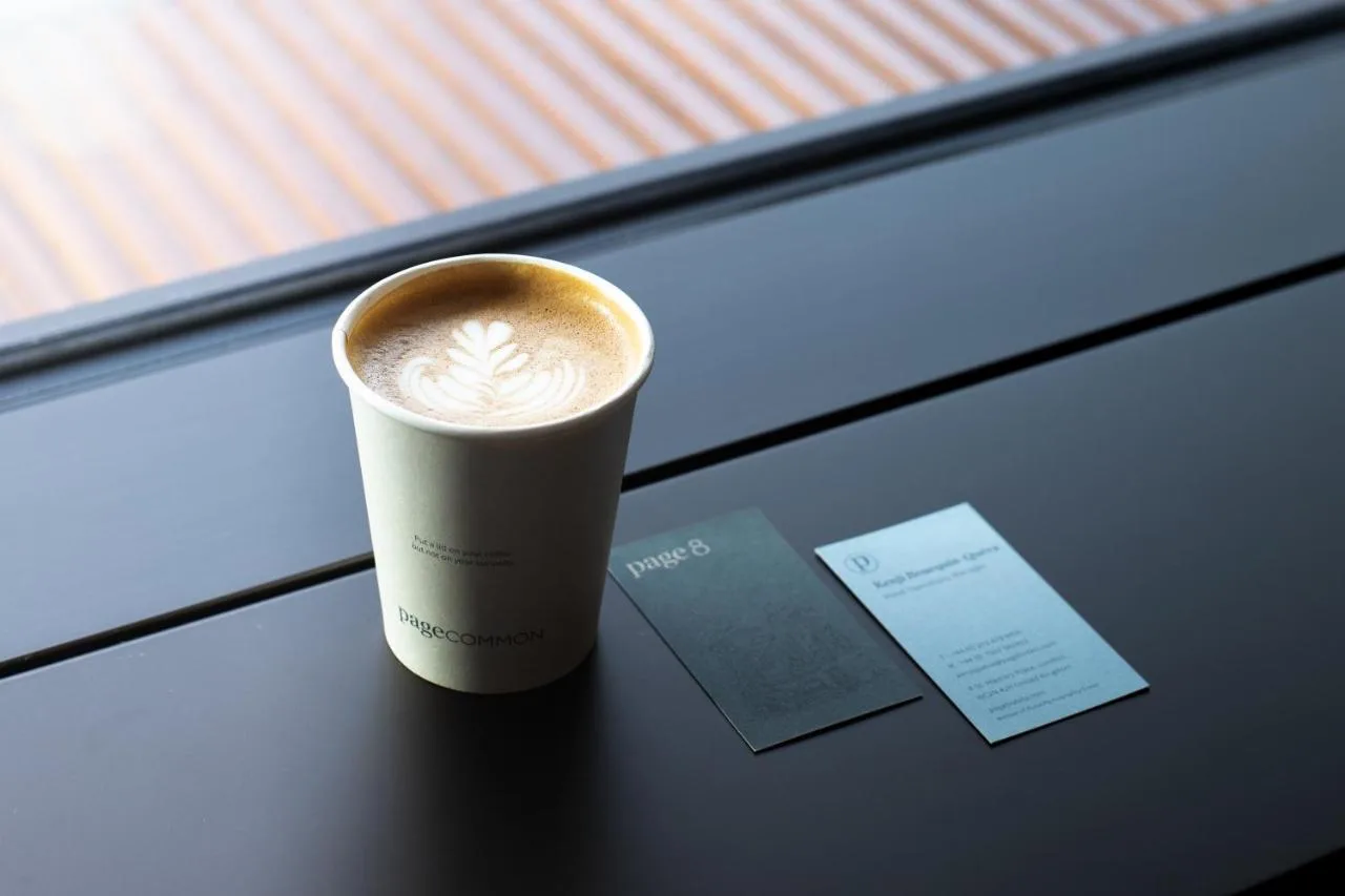 a cup of coffee sitting on top of a table at Page8, Page Hotels in London