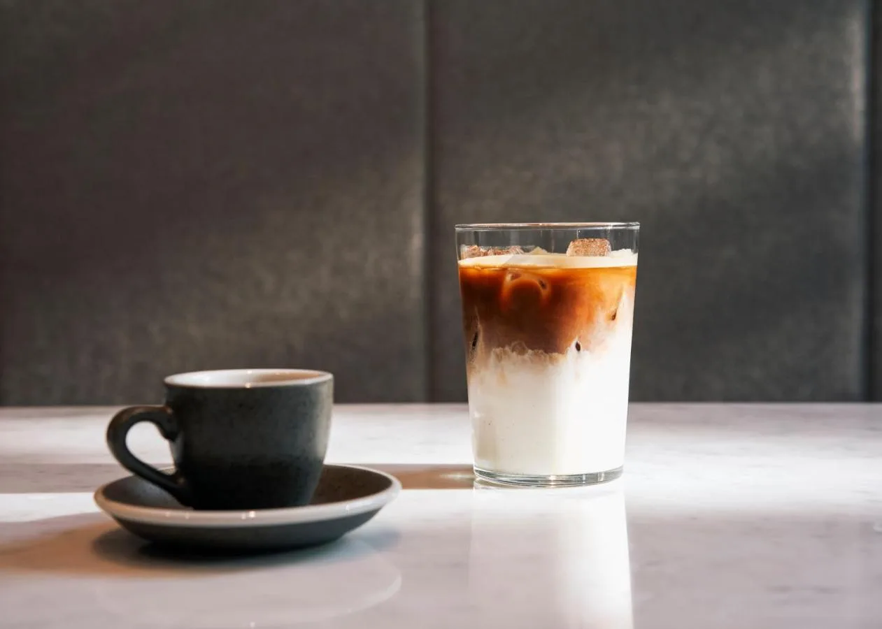 a drink and a cup of coffee on a table at Page8, Page Hotels in London